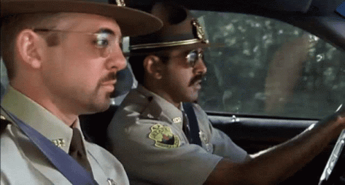 Two Sheriffs Sitting In Car With Texas Patch GIF