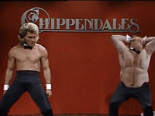 Two Shirtless Men Are Dancing In Front Of A Sign That Says Hippendales GIF