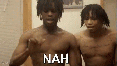 Two Shirtless Men Are Standing Next To Each Other In A Room With The Word Nah Written On The Screen . GIF