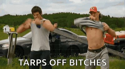 Two Shirtless Men Dancing In Field GIF