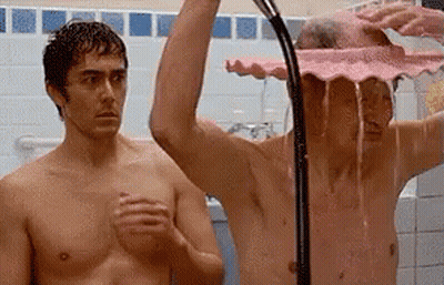 Two Shirtless Men Showering With Pink Shower Head GIF
