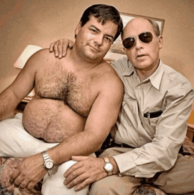 Two Shirtless Men Sitting On Bed GIF