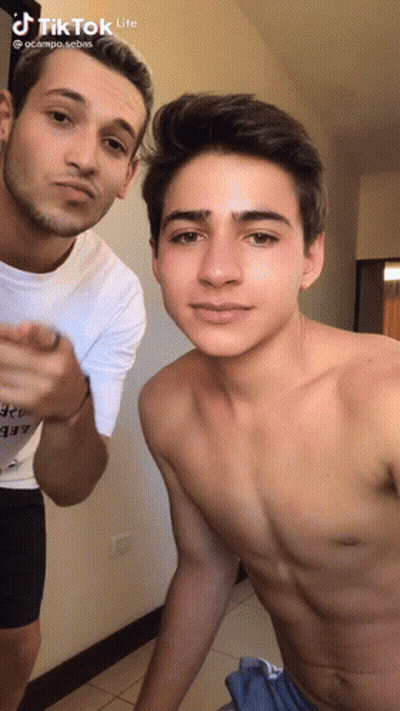 Two Shirtless Men Standing In Room GIF
