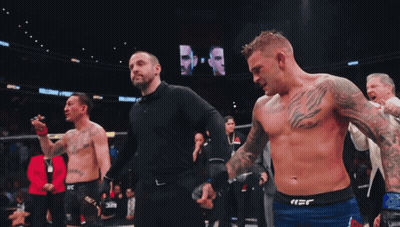 Two Shirtless Men Standing On Field GIF