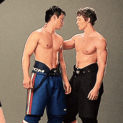 Two Shirtless Men Standing, Shorts Say CCM GIF