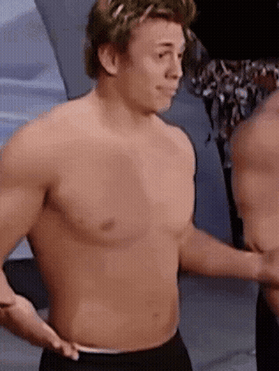 Two Shirtless Men Standing Together GIF