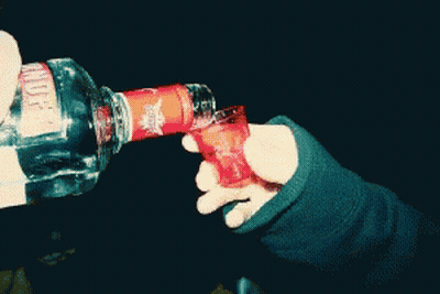 Two Shot Glasses Of Beer On A White Plate With Lime Wedges GIF