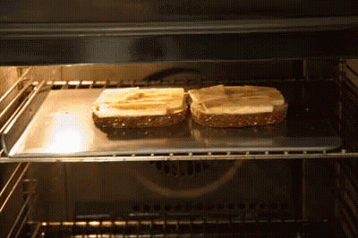 Two Slices Of Bread Toasting In Oven GIF