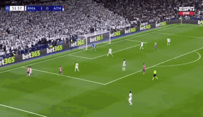 Two Soccer Players Are Celebrating A Goal During A Soccer Game . GIF