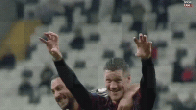 Two Soccer Players Are Celebrating With Their Arms In The Air And The Words Spor Canli On The Bottom GIF