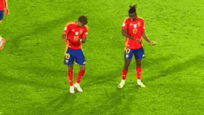 Two Soccer Players Are Dancing On The Field And One Has The Number 17 On His Shorts GIF