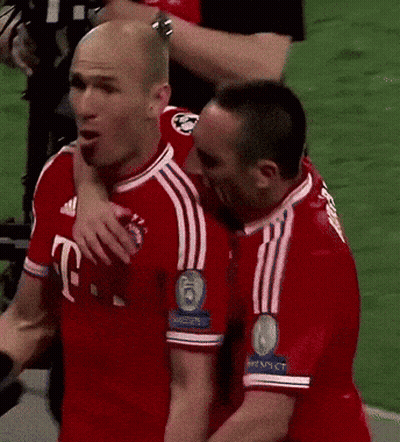 Two Soccer Players Are Hugging Each Other And One Has The Number 6 On His Shirt GIF