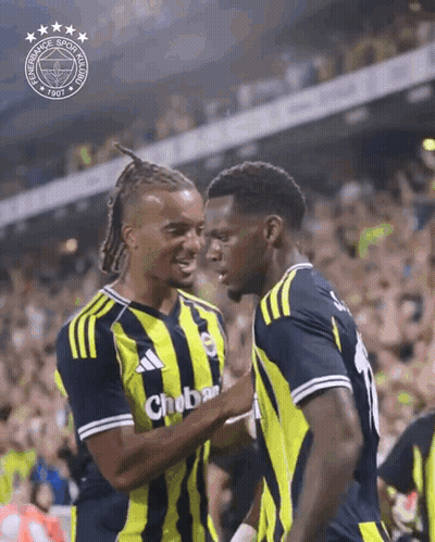 Two Soccer Players Are Hugging Each Other In Front Of A Crowd And One Of Their Shirts Says Chobar GIF