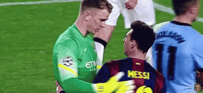 Two Soccer Players Are Hugging Each Other On A Field . GIF