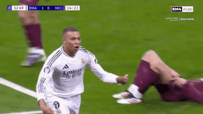 Two Soccer Players Are Hugging Each Other On A Field . GIF