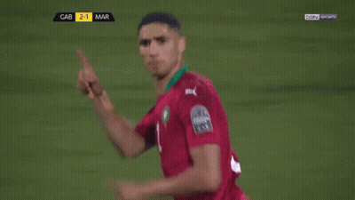 Two Soccer Players Are Hugging Each Other On A Field With Bein Sports On The Screen Behind Them GIF