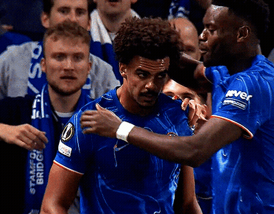 Two Soccer Players Are Hugging Each Other With One Wearing A Shirt That Says River GIF