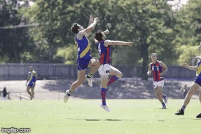 Two Soccer Players Are Jumping In The Air While One Has The Number 3 On His Jersey GIF