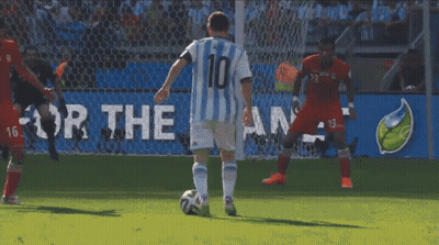 Two Soccer Players Are Playing In Front Of A Large Fifa Logo GIF