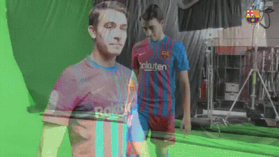 Two Soccer Players Are Standing In Front Of A Green Screen GIF