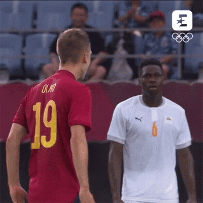 Two Soccer Players Are Standing Next To Each Other And One Has The Number 19 On His Shirt GIF