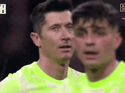 Two Soccer Players Are Standing Next To Each Other And One Of Them Has The Number 1 On His Shirt GIF