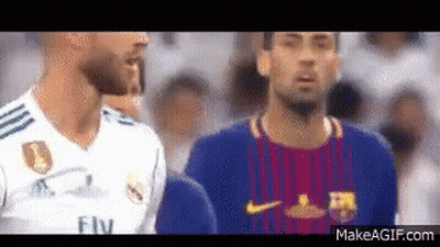 Two Soccer Players Are Standing Next To Each Other In A Crowd . GIF