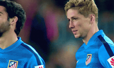 Two Soccer Players Are Standing Next To Each Other In Blue Jerseys GIF