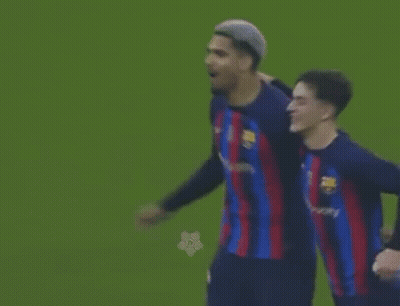 Two Soccer Players Are Standing Next To Each Other On The Field . GIF