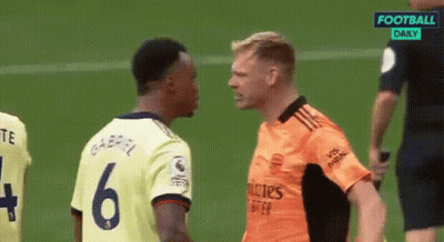Two Soccer Players Are Standing Next To Each Other On The Field . GIF