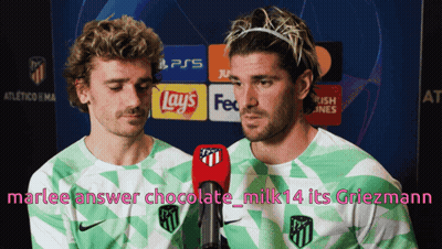 Two Soccer Players Are Talking Into Microphones In Front Of A Sign That Says Ps5 GIF