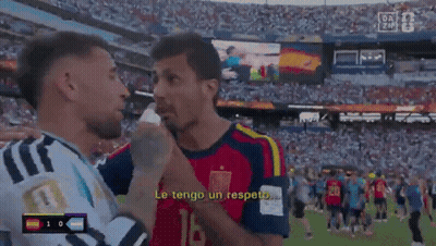Two Soccer Players Are Talking To Each Other And One Of Them Is Wearing A Jersey With The Number 10 On It GIF