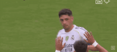 Two Soccer Players Are Walking On A Field And One Of Them Has The Number 8 On His Back . GIF