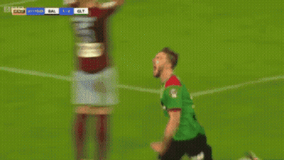 Two Soccer Players Celebrating A Goal GIF