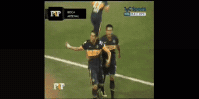 Two Soccer Players Celebrating Goal In Front Of TV Saying Pt GIF