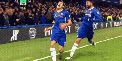 Two Soccer Players Celebrating Goal GIF