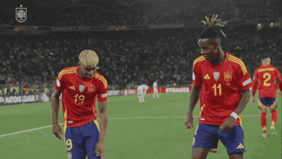 Two Soccer Players Dancing in Number 11 Jerseys