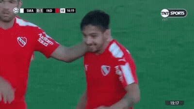 Two Soccer Players Fist Bumping GIF