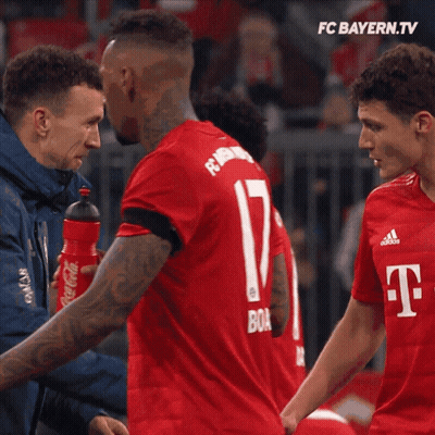 Two Soccer Players High Five FC Bayern.tv Advertisement GIF