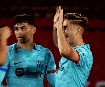 Two Soccer Players High Fiving GIF