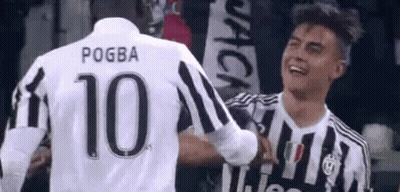 Two Soccer Players Hugging During Game GIF
