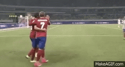 Two Soccer Players Hugging Number 7 GIF