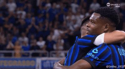 Two Soccer Players Hugging One With Letter G GIF