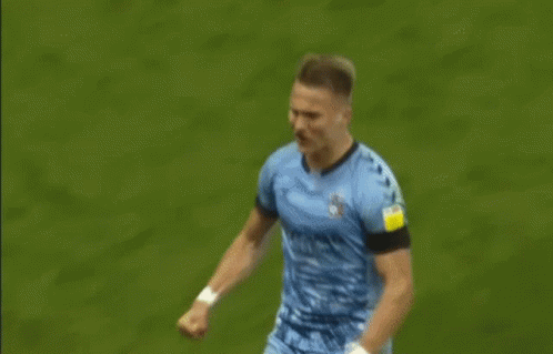 Two Soccer Players Hugging GIF