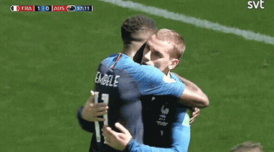 Two Soccer Players Hugging With SVT Logo On Field GIF