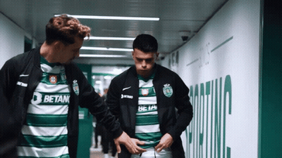 Two Soccer Players In Betan Jerseys In Tunnel GIF