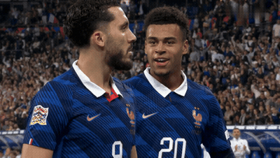 Two Soccer Players In Blue Jerseys Number 20 GIF