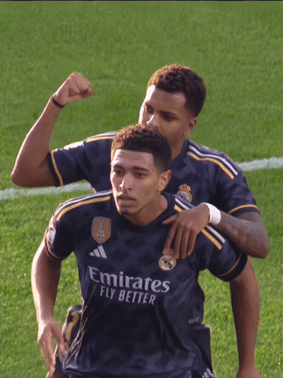 Two Soccer Players In Emirates Fly Better Jerseys Celebrate On Field GIF