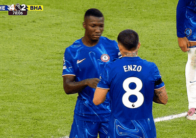 Two Soccer Players In Number 10 Jerseys Celebrating Goal GIF