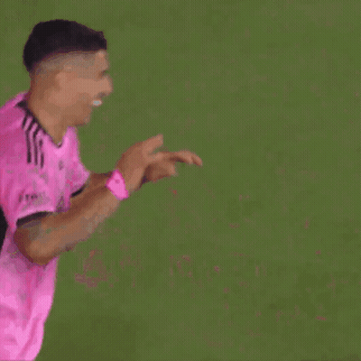 Two Soccer Players In Pink Jerseys High Five GIF